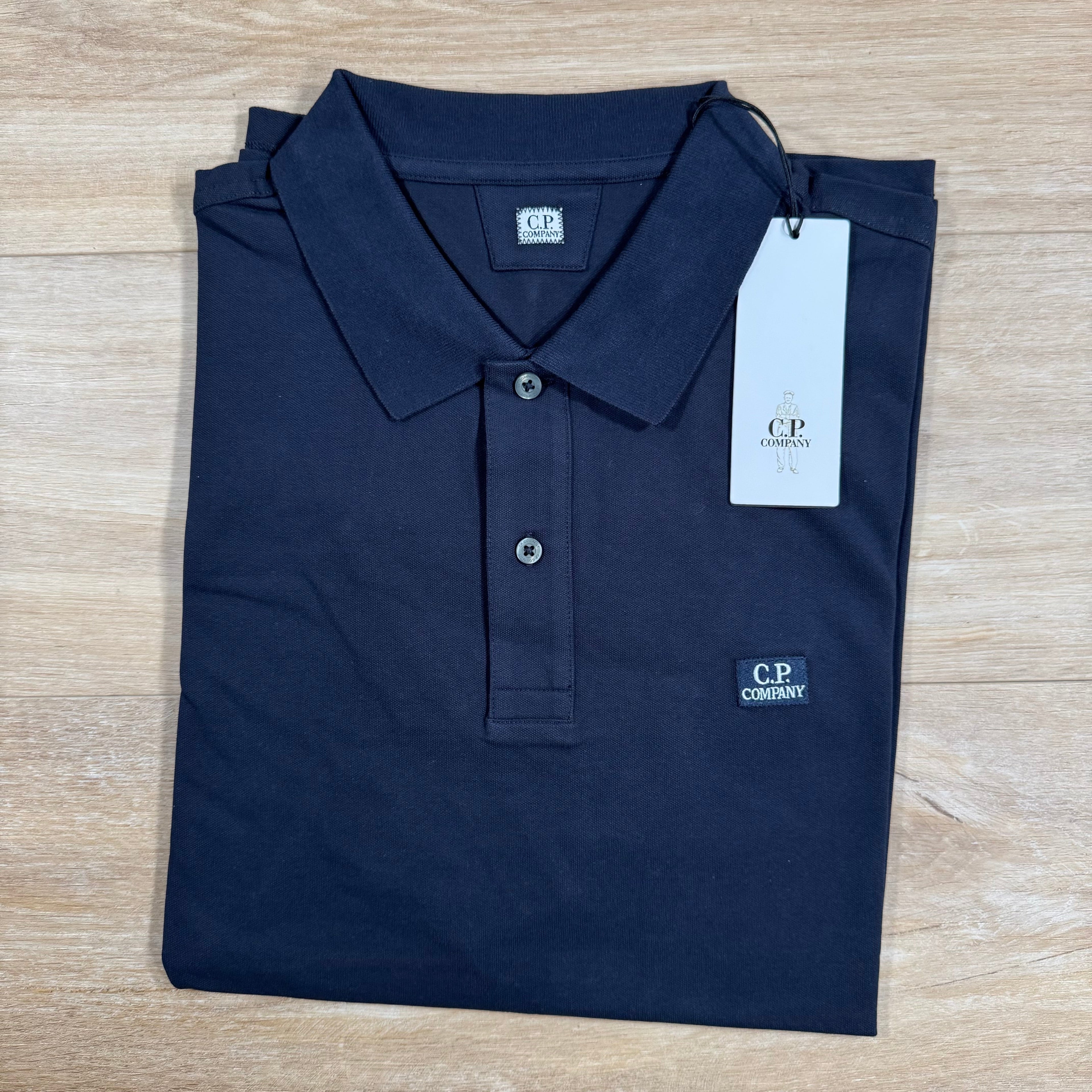 CP Company Stretch Piquet Logo Polo Shirt in Black Sand Ironleague