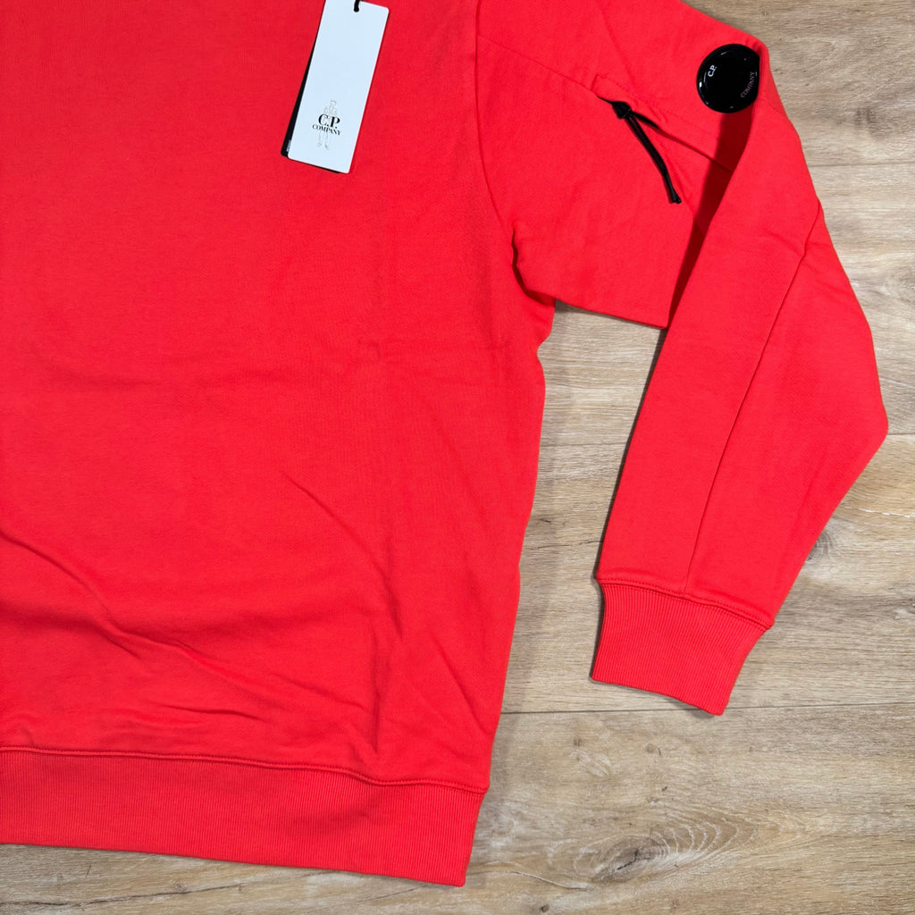 CP Company Diagonal Raised Fleece Lens Sweatshirt in Poinciana Orange Ironleague