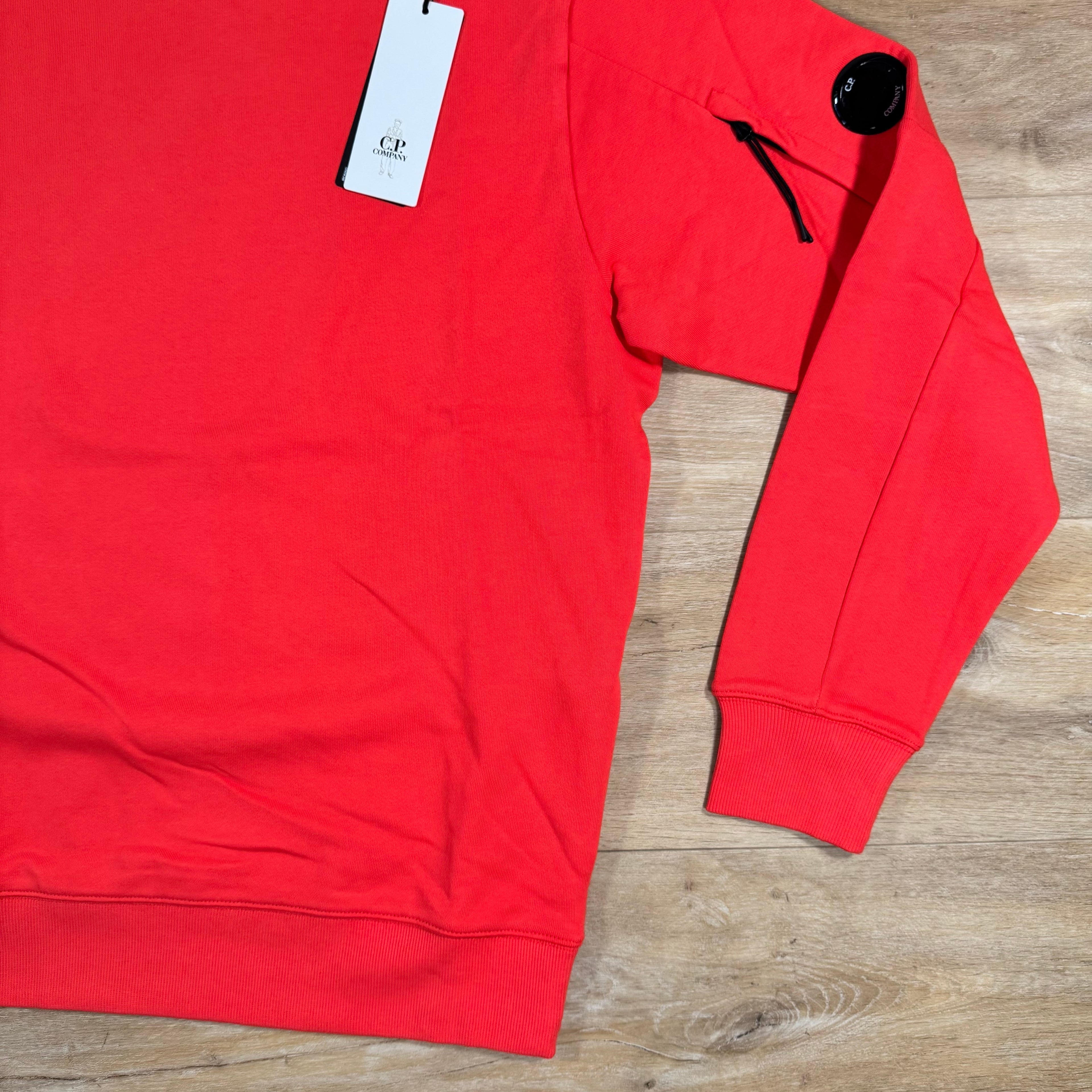 CP Company Diagonal Raised Fleece Lens Sweatshirt in Poinciana Orange Ironleague