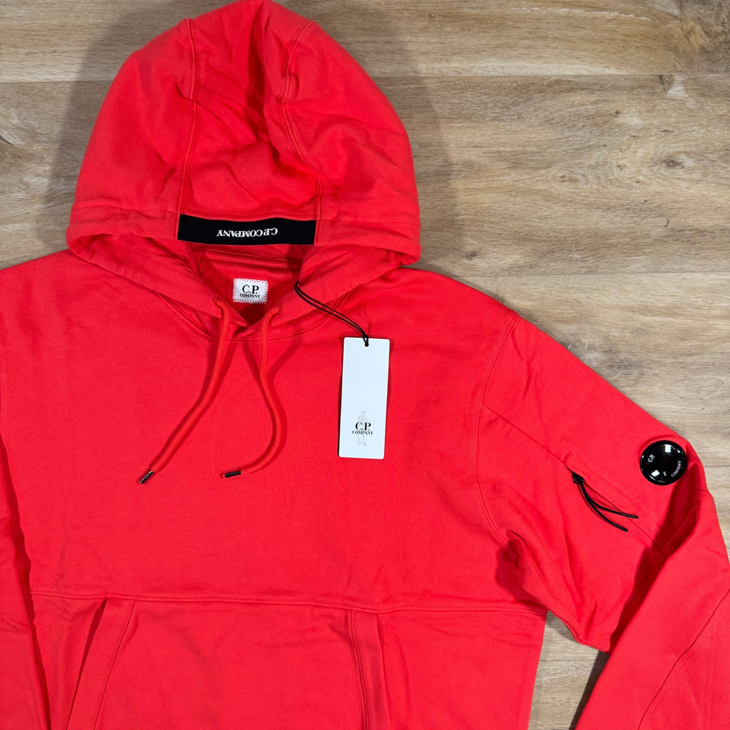 CP Company Diagonal Raised Fleece Lens Hoodie in Poinciana Orange Ironleague