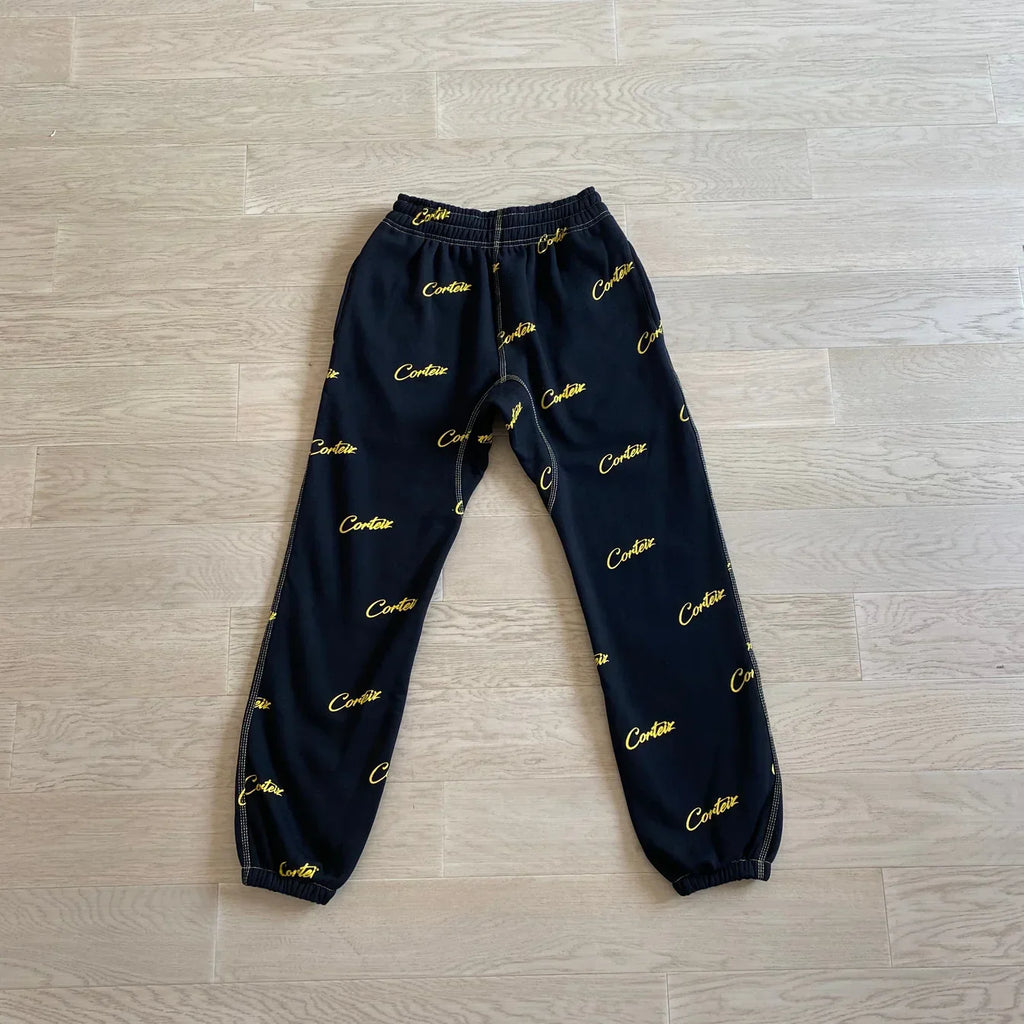 Corteiz All Over Print Joggers - Black/Yellow Ironleague