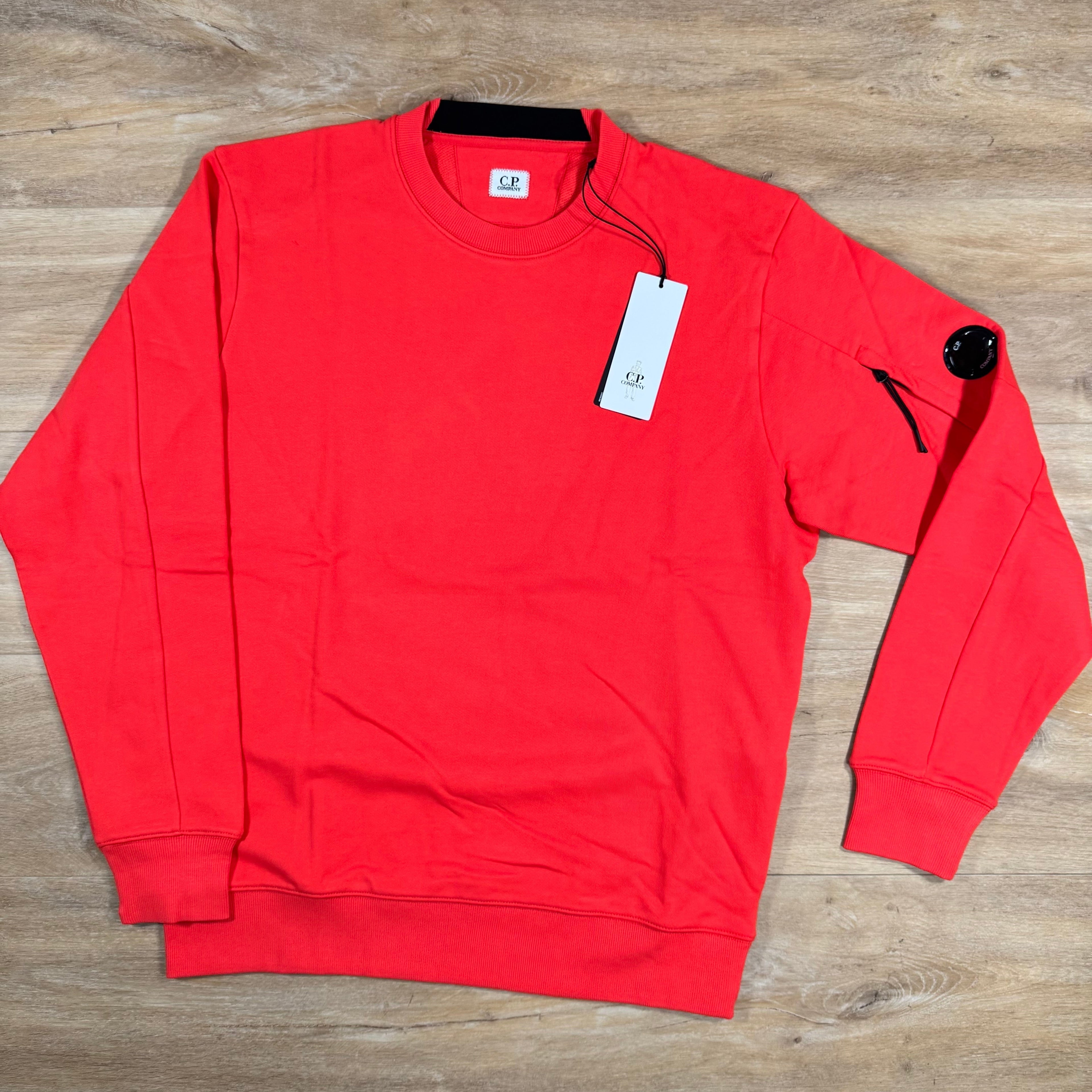 CP Company Diagonal Raised Fleece Lens Sweatshirt in Poinciana Orange Ironleague