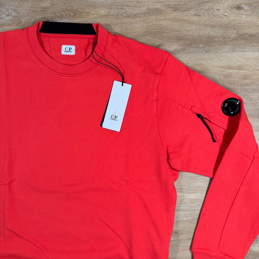 CP Company Diagonal Raised Fleece Lens Sweatshirt in Poinciana Orange Ironleague