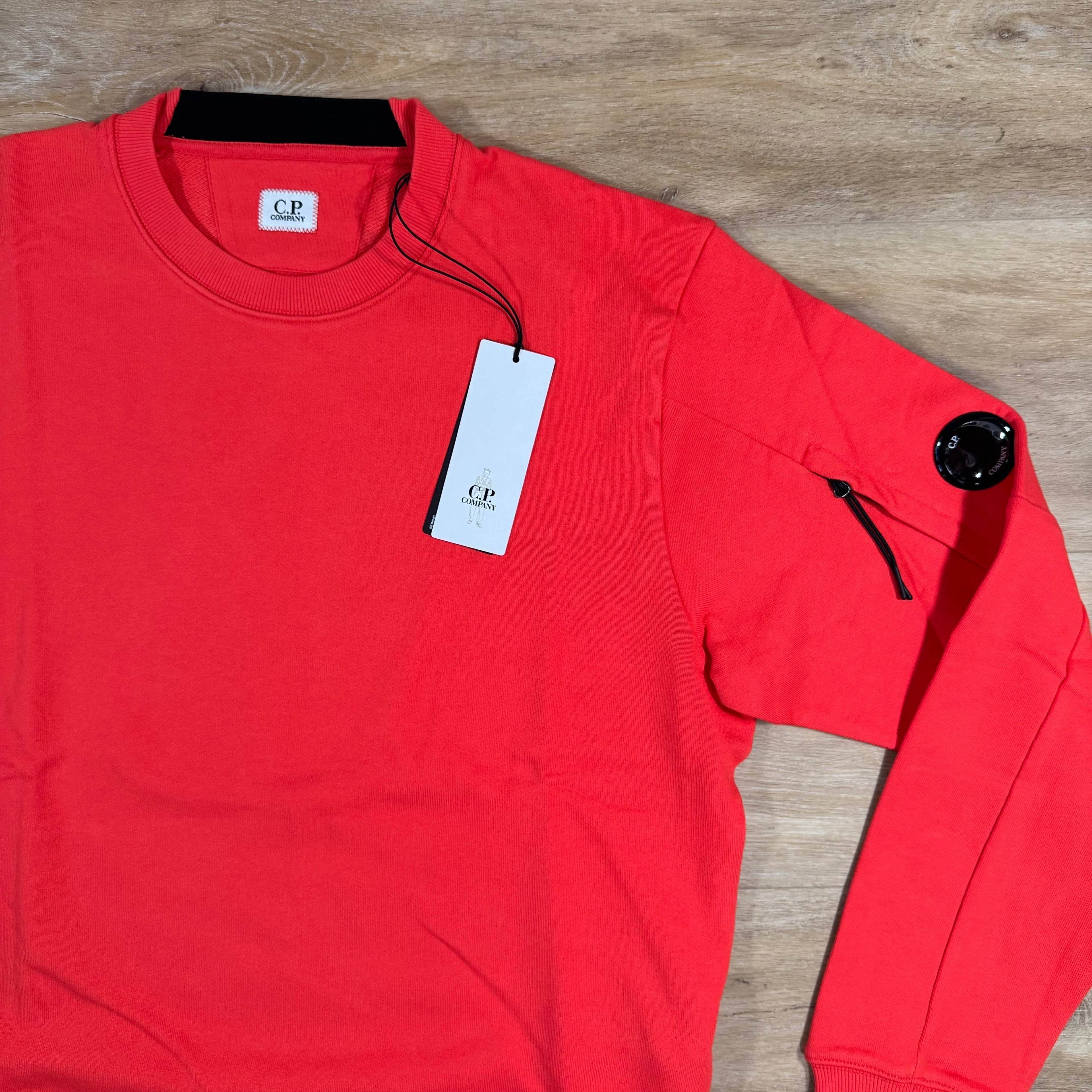 CP Company Diagonal Raised Fleece Lens Sweatshirt in Poinciana Orange Ironleague