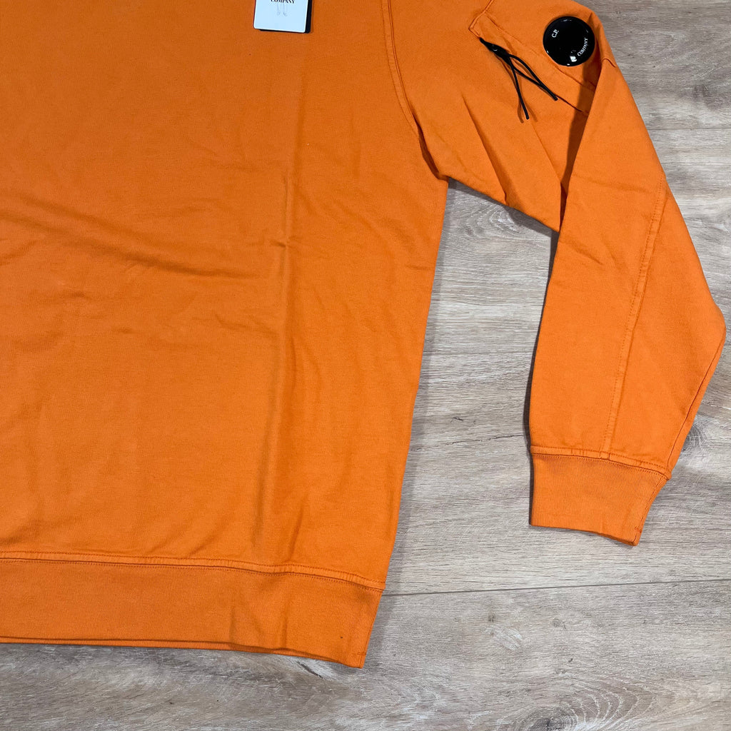 CP Company Light Fleece Crewneck Lens Sweatshirt in Russet Orange Ironleague