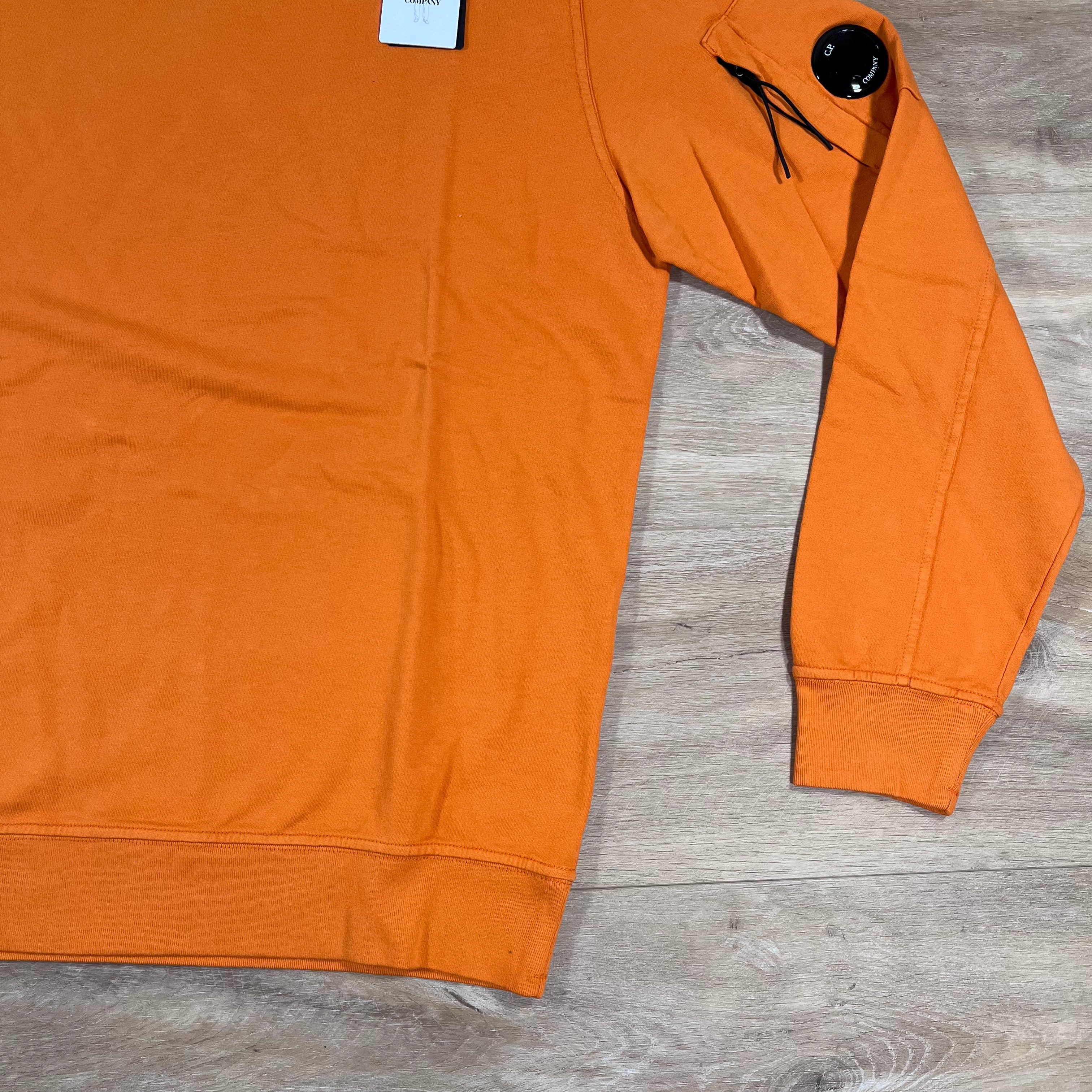CP Company Light Fleece Crewneck Lens Sweatshirt in Russet Orange Ironleague
