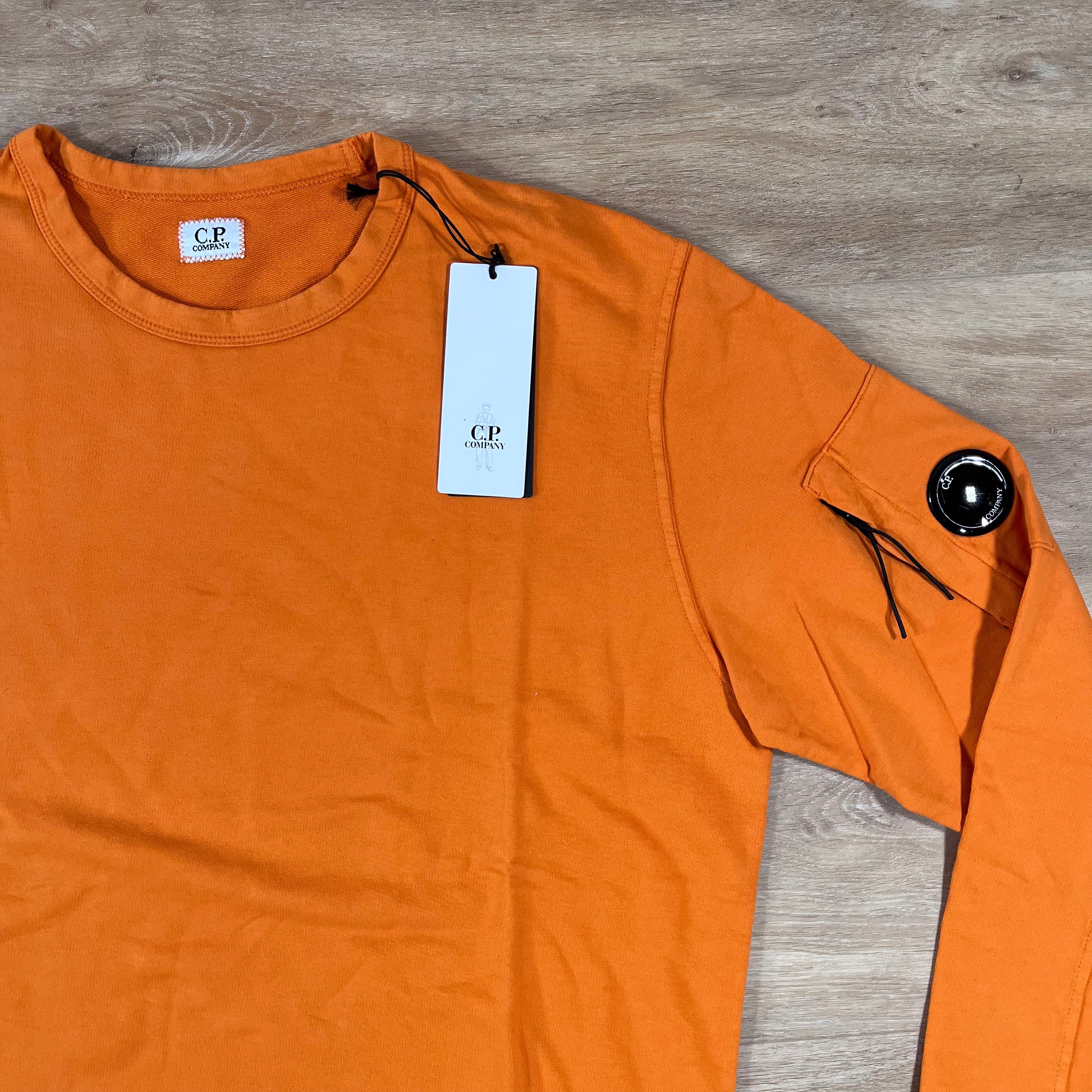 CP Company Light Fleece Crewneck Lens Sweatshirt in Russet Orange Ironleague
