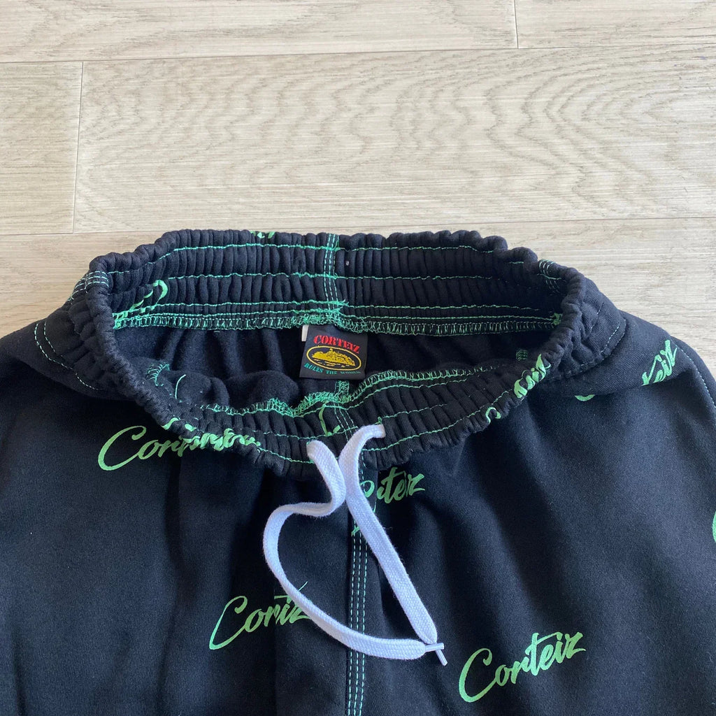 Corteiz All Over Print Joggers - Black/Green Ironleague
