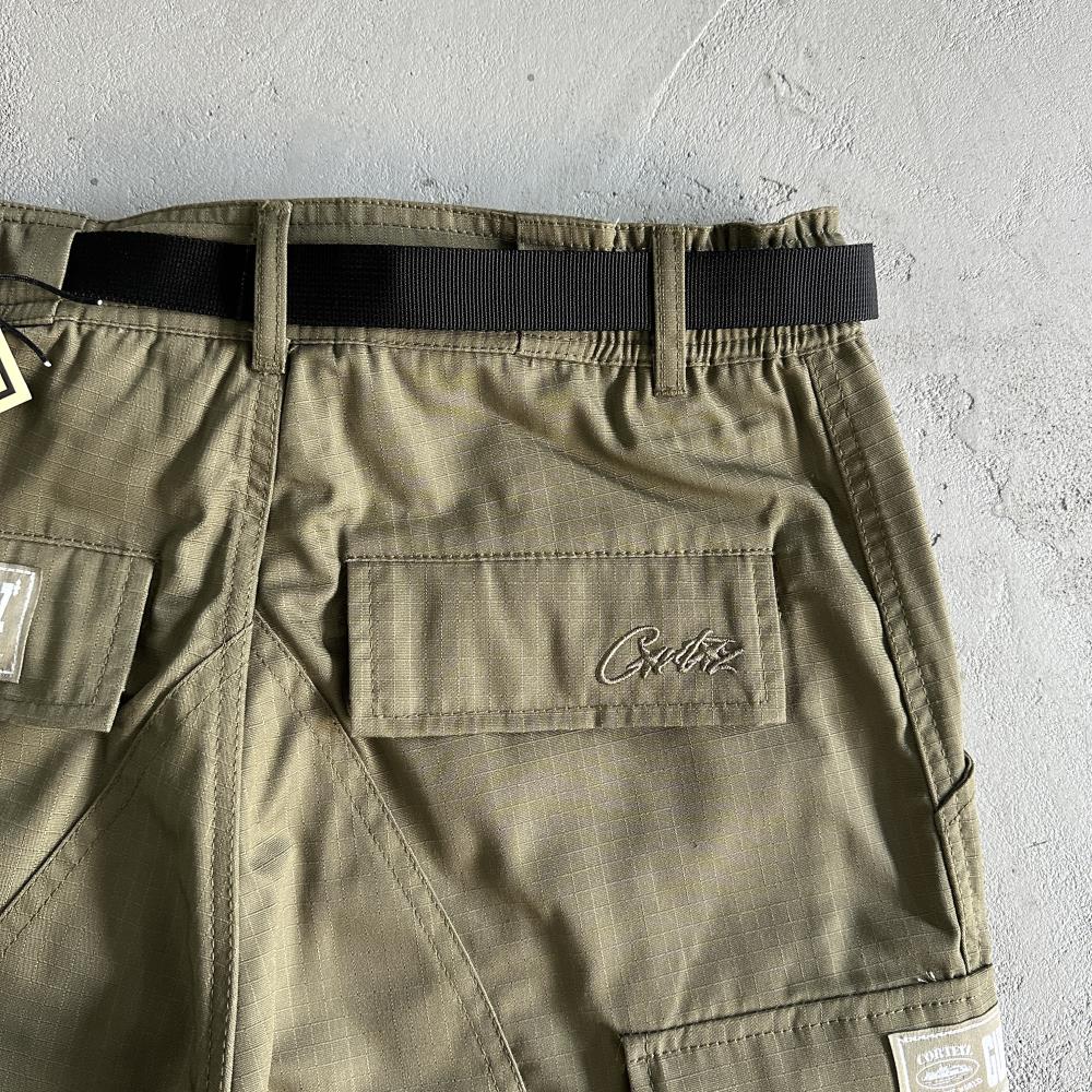Corteiz Logo Patch Cargo Pants - Military Green Ironleague